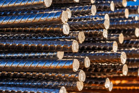 Close-up of the ends of stacked steel reinforcing bars